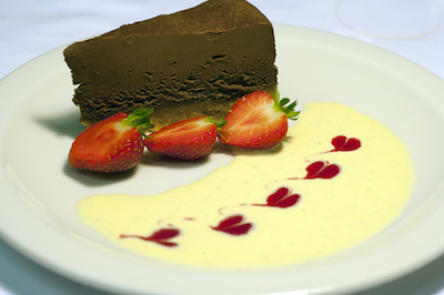 Chocolate dessert with cream and Strawberries