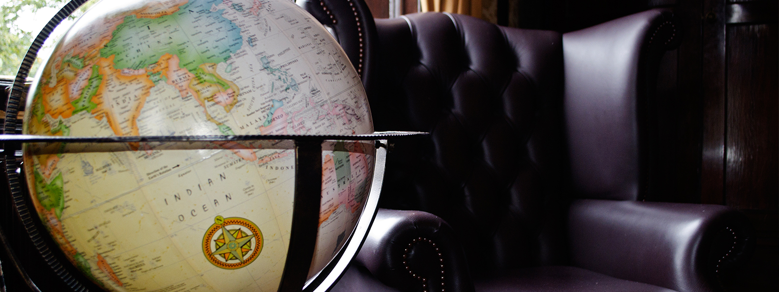 Globe and leather chair