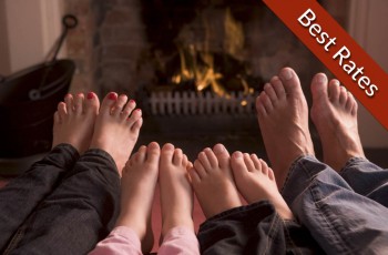Winter Warmer offer image with family warming their feet by the fire