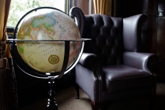 A globe and armchair in our Suite
