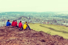 People looking over Edinburgh from Arthur's Seat