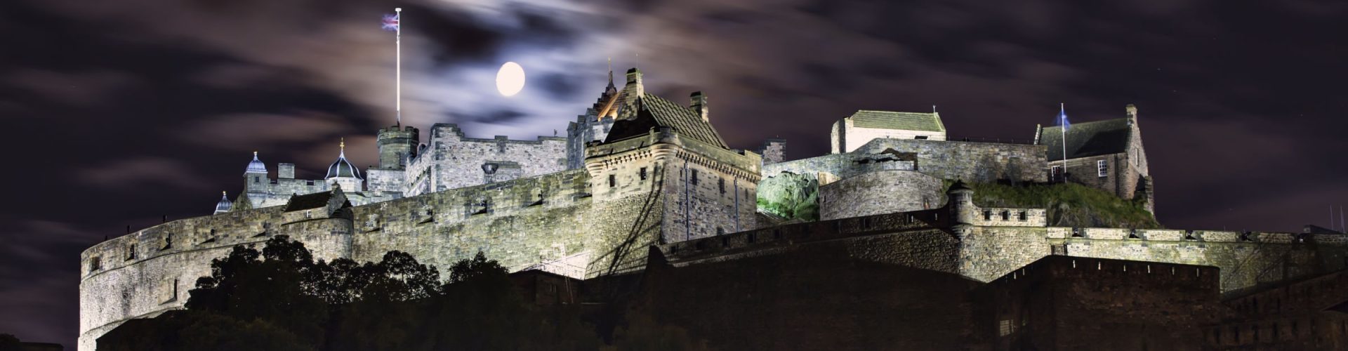 Edinburgh Castle at night, with a full moon