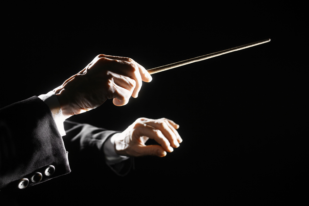 Conductors hands with dark background
