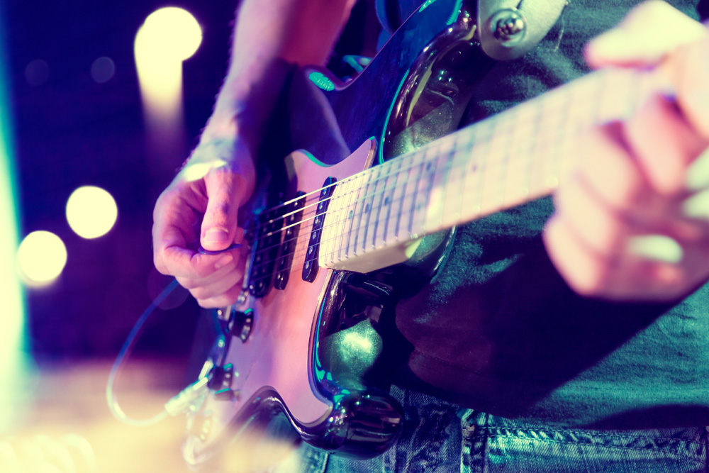 Close up of guitar on stage at a concert