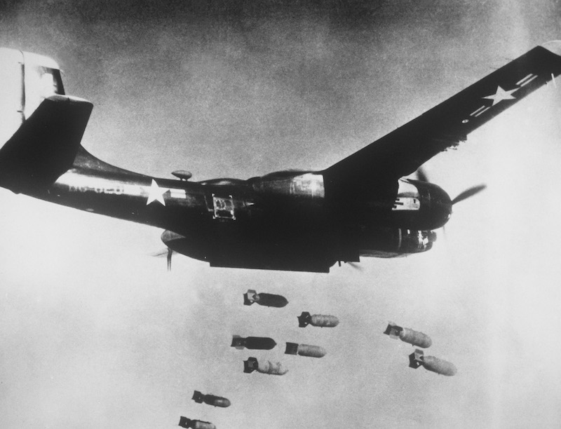 Bomber plane dropping bombs in World War 2