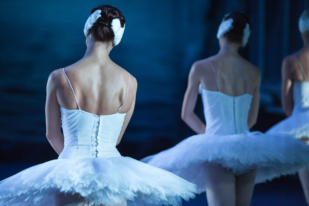 Ballerinas with backs turned in white