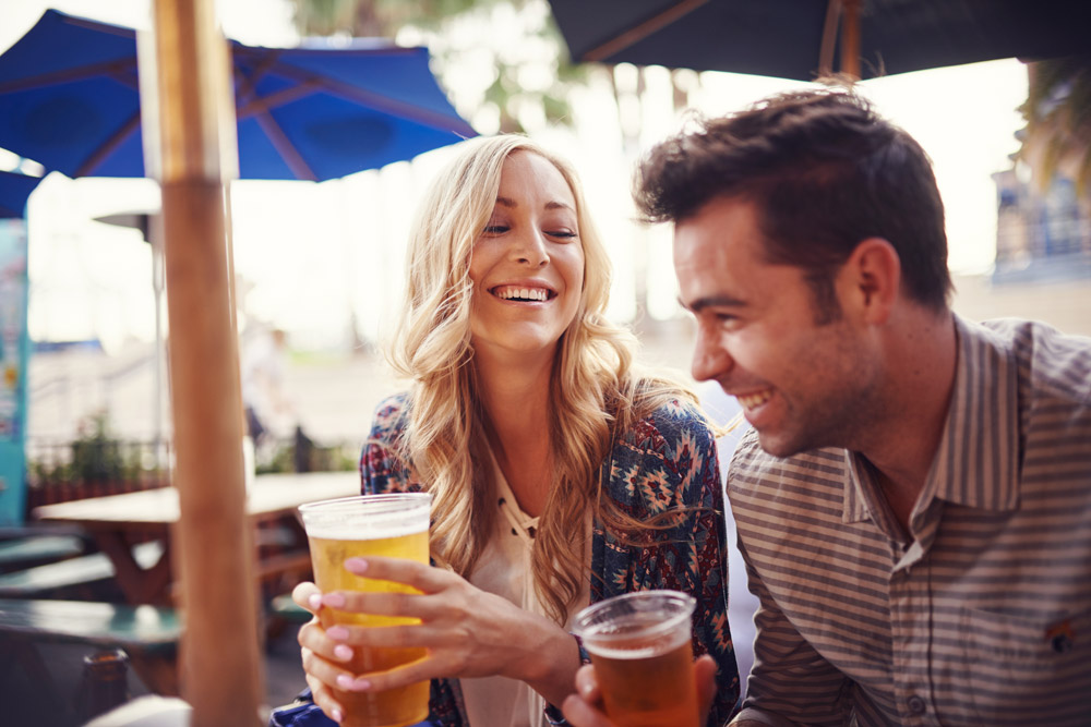 Couple drinking outside in beer garden
