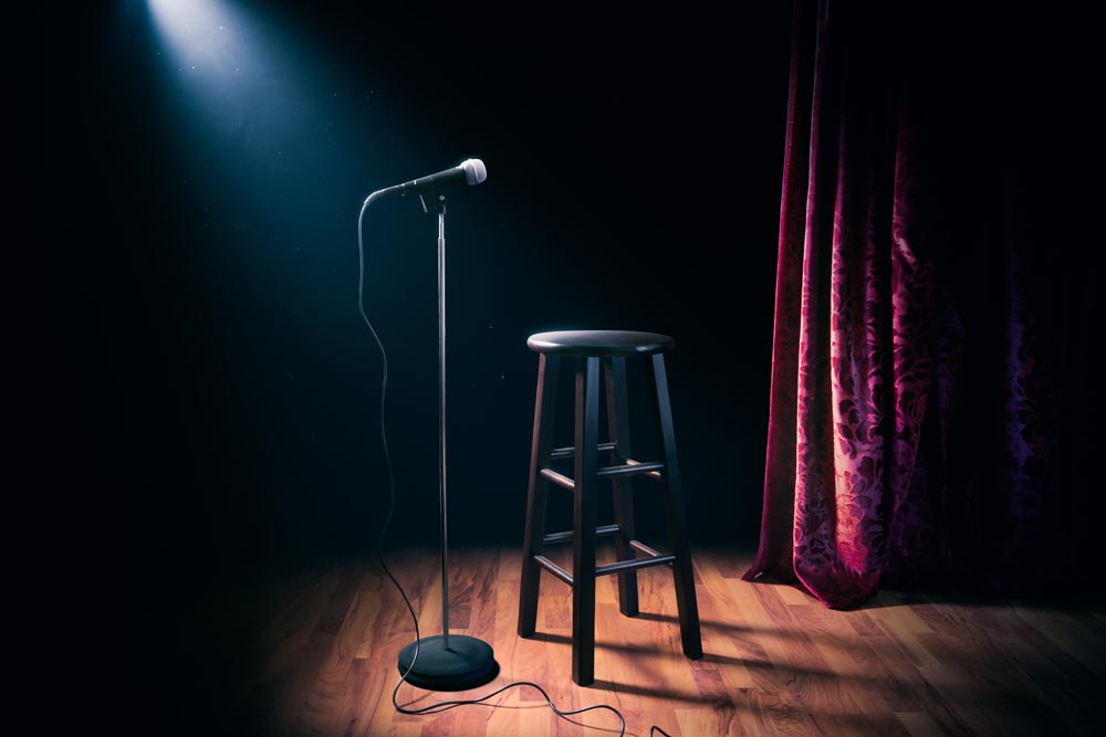 Mic and stool at a comedy club