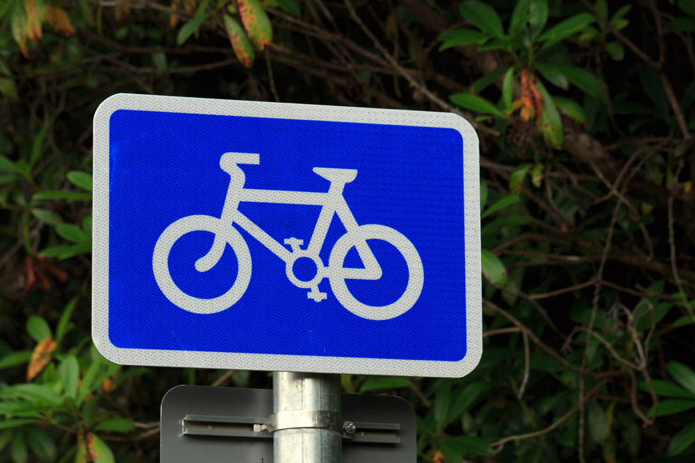 Blue sign with white bike symbol
