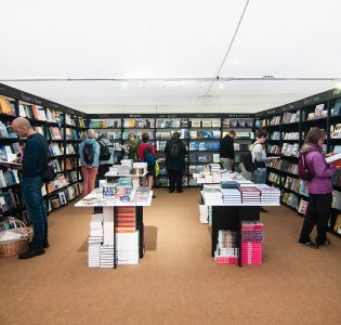 People browsing the Gardens Bookshop at the Edinburgh International Book Festival