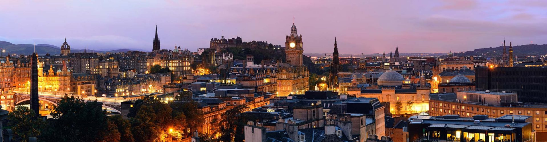 The city of Edinburgh lit up at dusk