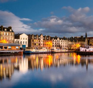 Leith in Edinburgh at night with lights reflecting on the water