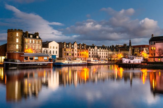 Leith in Edinburgh at night with lights reflecting on the water