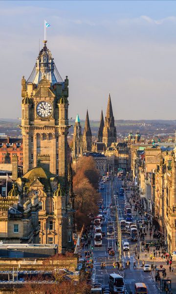 Looking down upon a busy Princes Street in Edinburgh during the day
