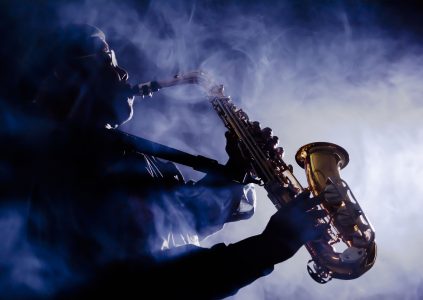 A saxophone player in a misty atmosphere