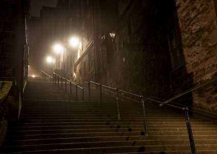 A dark and spooky foggy stairway in an old street in Edinburgh