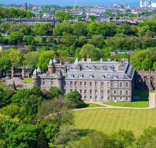 An aerial view of Holyrood Palace with Edinburgh in the background