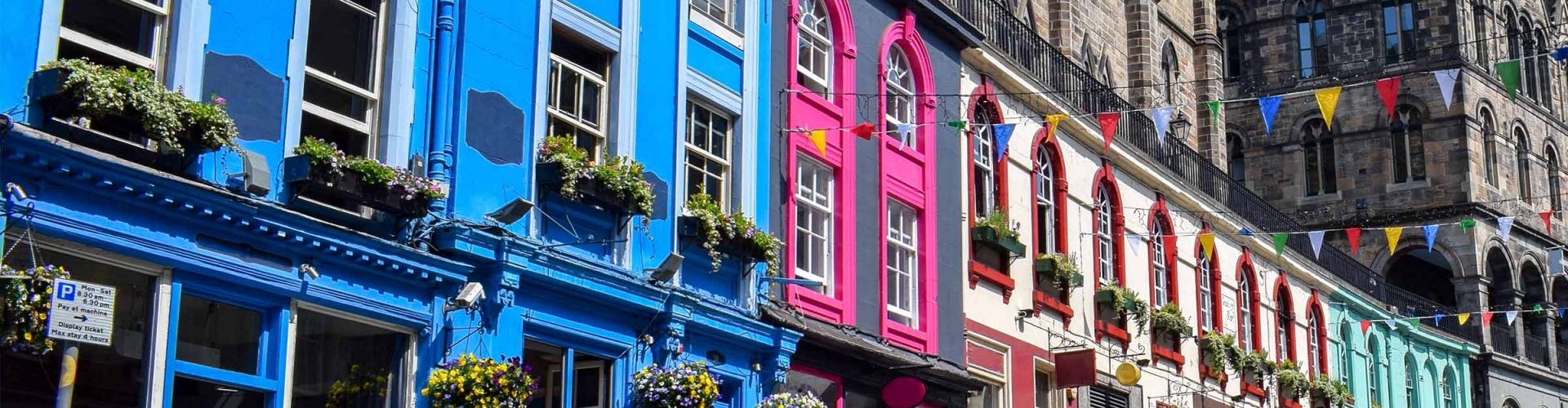 The colourful exterior of the buildings and shops on Victoria Street in Edinburgh
