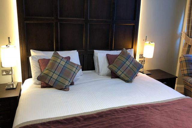 A double bed in Parliament House Hotel