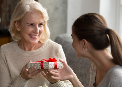 A daughter giving her mother a gift