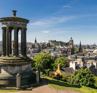 The Burns Monument on Calton Hill with the city of Edinburgh in the background