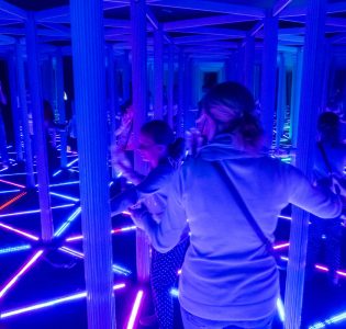 People in a mirrored maze in Camera Obscura Edinburgh