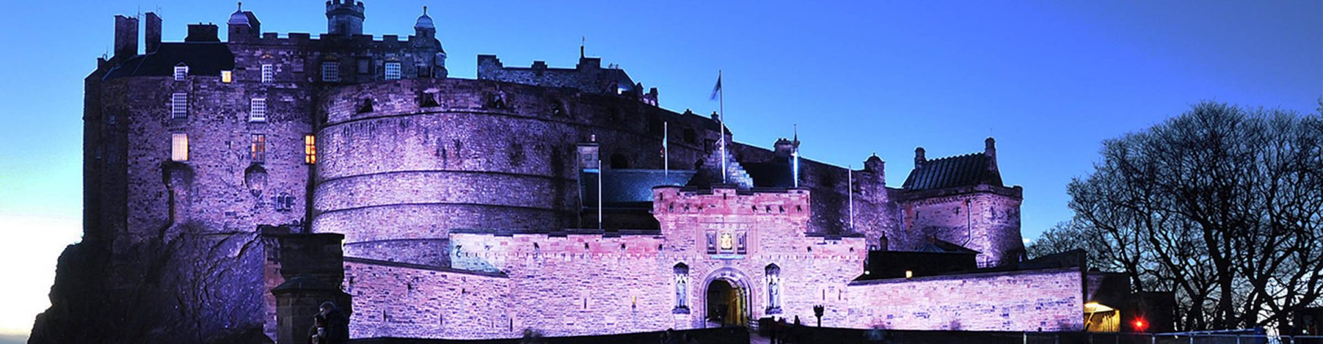 The entrance to Edinburgh Castle at night dramatically lit up