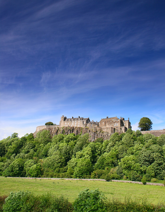 Stirling Castle on the rock with blue skies behind