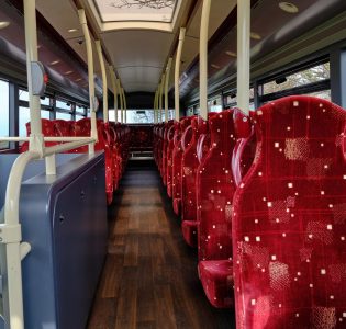 Interior of an Edinburgh bus with red seats