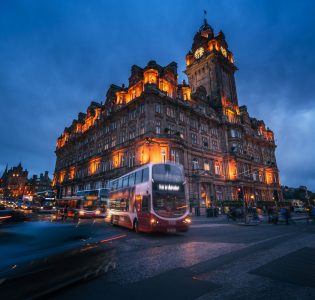 Blurry image of a bus on the streets of Edinburgh at night