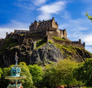 View of Edinburgh Castle and Ross Fountain from Princes Street Gardens