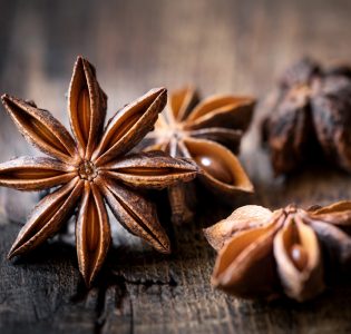 Anise stars on a wooden table