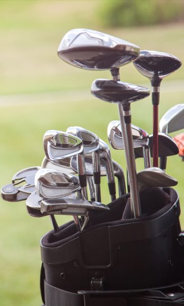 Golf clubs in a bag, on the course