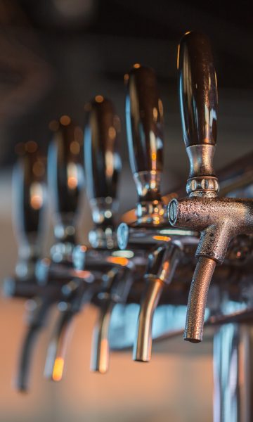 Row of beer taps in a bar
