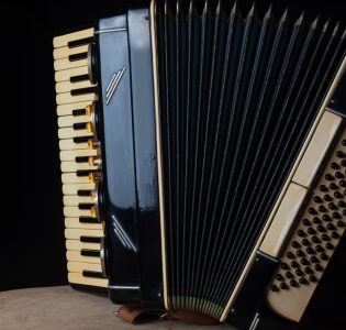 An accordion musical instrument on a stool