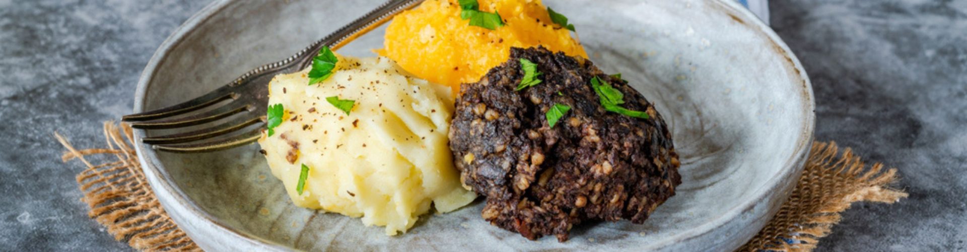 Haggis, neeps and tatties (haggis with turnips and potatoes) - traditional Scottish dish for Burns Night.