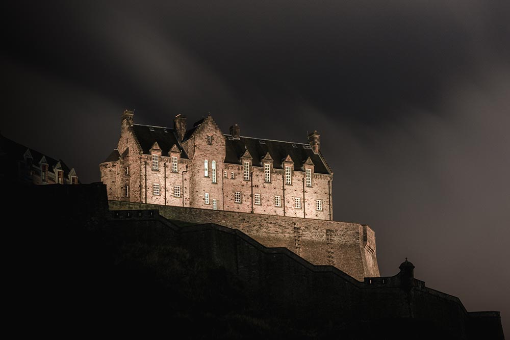 Edinburgh Castle on a foggy night.